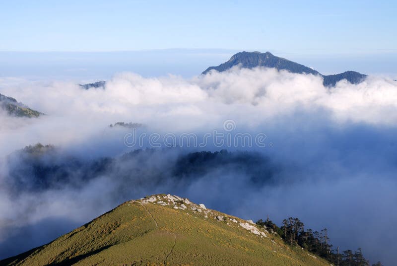 Mountain landscape in taiwan,asia with green grass and mist cloud. Mountain landscape in taiwan,asia with green grass and mist cloud.