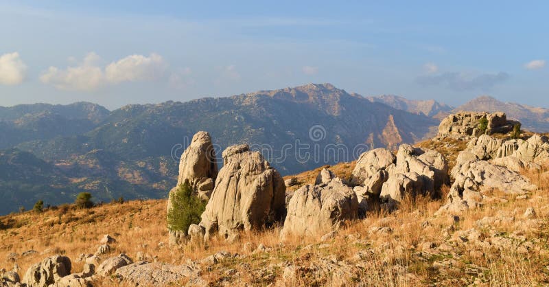 Mountains landscape and village during fall in mount lebanon, Desertic landscape on the site where there used to be cedar forest, near Faraya  Natural landscape lebanon, summits, wilderness, desertic, brown, wide, spacefull, Faraya. Mountains landscape and village during fall in mount lebanon, Desertic landscape on the site where there used to be cedar forest, near Faraya  Natural landscape lebanon, summits, wilderness, desertic, brown, wide, spacefull, Faraya