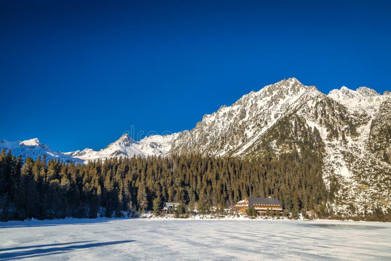 Mountain landscape with frozen tarn at winter season