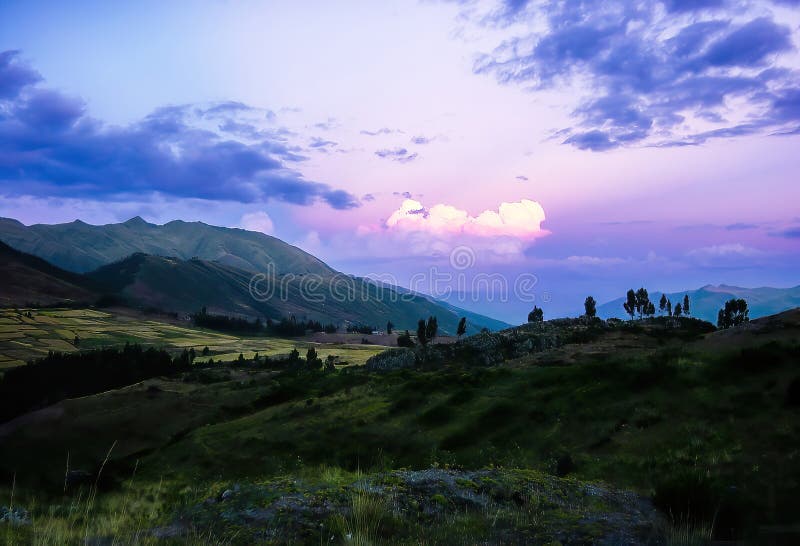 Purple sunset sky above the Andes Mountains foothills near Cuzco Peru. Spectacular mountain landscape.