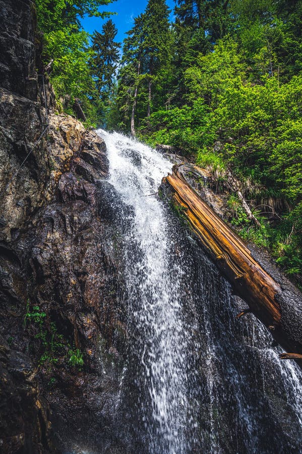 Mountain landscape in Slovakia. Magical forest in natural park .People climbing on steep rock on via ferrata martinske hole