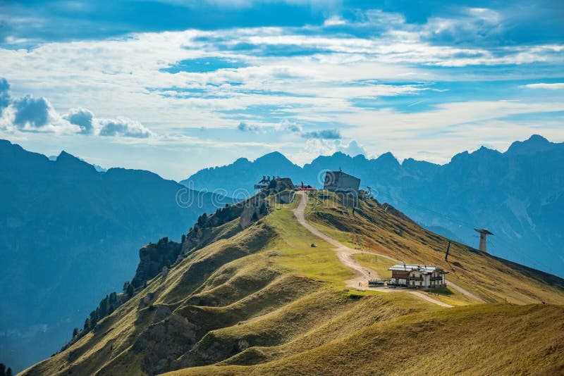 Mountain landscape with trail and refudjio, Passo Prdoi, Dolomite Alps, Italy. Mountain landscape with trail, green meadow and refudjio, Passo Prdoi, Dolomite stock image Mountain landscape with trail and refudjio, Passo Prdoi, Dolomite Alps, Italy. Mountain landscape with trail, green meadow and refudjio, Passo Prdoi, Dolomite stock image