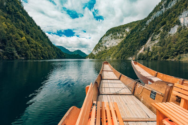 Wooden boat on mountain lake. Nature in the mountains