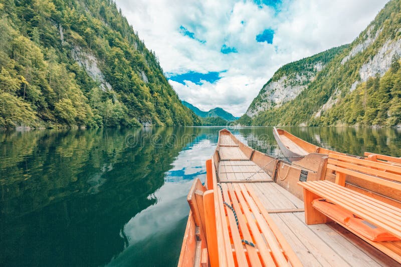 Wooden boat on mountain lake. Nature in the mountains