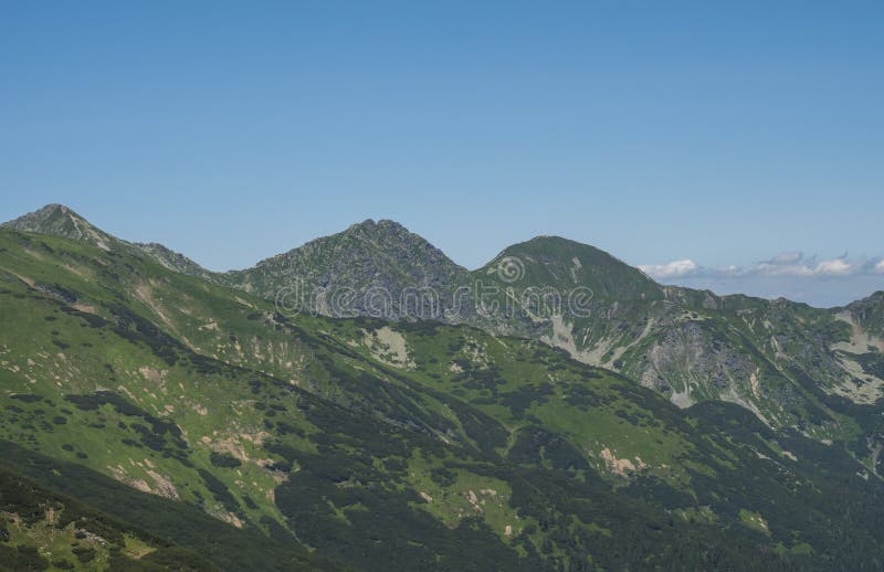Mountain landscape of Western Tatra mountains or Rohace with view on ostry rohac two peaks from hiking trail on Baranec