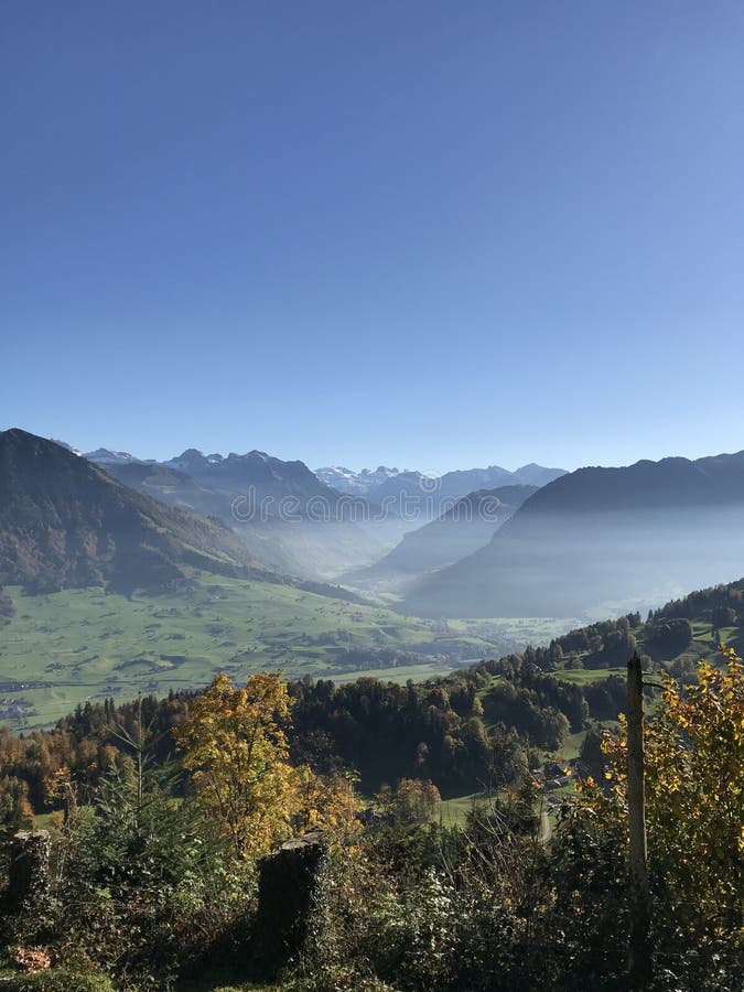 Mountain Panorama With Different Layers And Blue Sky At Buergenstock In