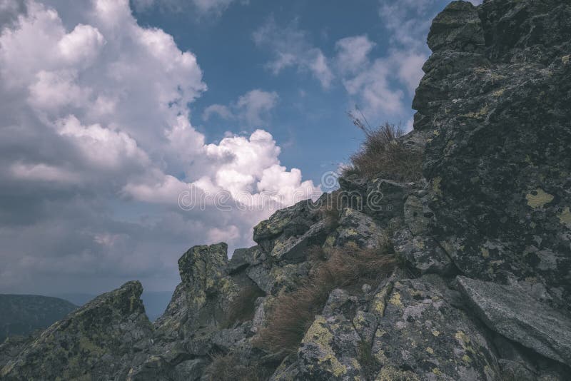 Mountain panorama from top of Banikov peak in Slovakian Tatra mountains with rocky landscape and shadows of hikers in bright day