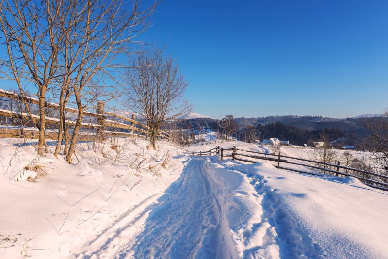 Mountain path in the snow, beautiful winter landscape with blue sky royalty free stock photography Mountain path in the snow, beautiful winter landscape with blue sky royalty free stock photography