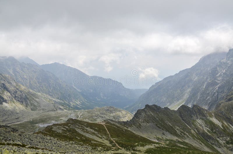 Mountain peaks, clouds and fog. High Tatras Mountains in Slovakia