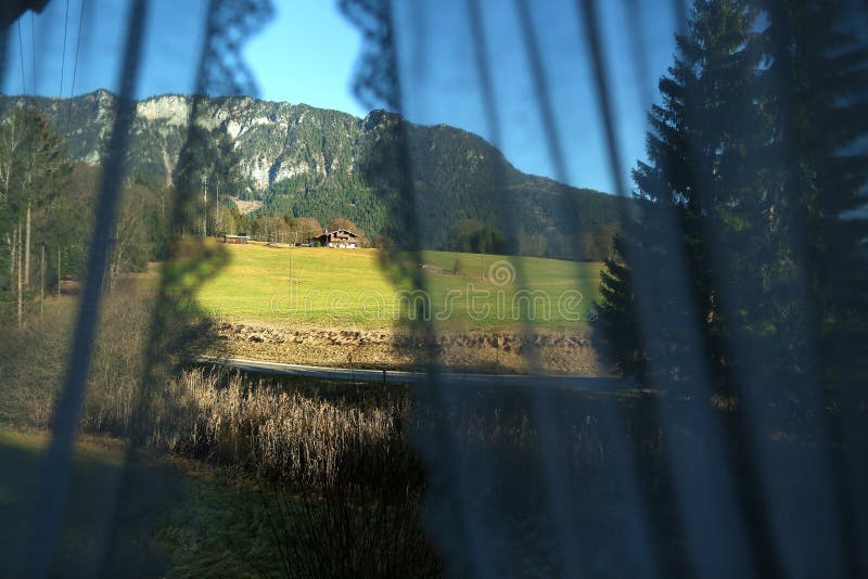 Mountain peaks seen through the curtains of my window