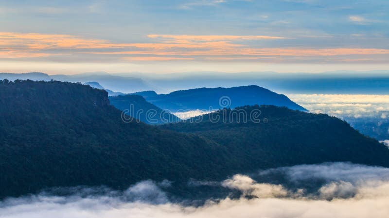 The mountain at Pha Mo I Daeng Cliff and the mist in the morning