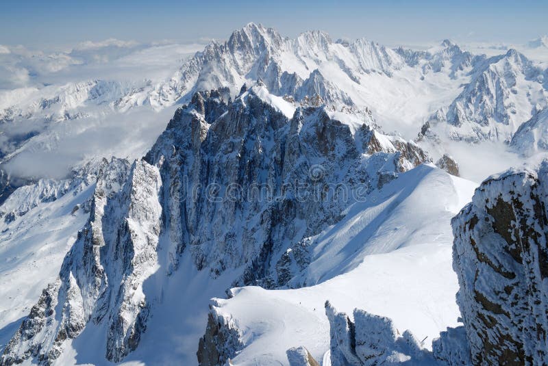 Mountain range among snow and clouds, the Alps