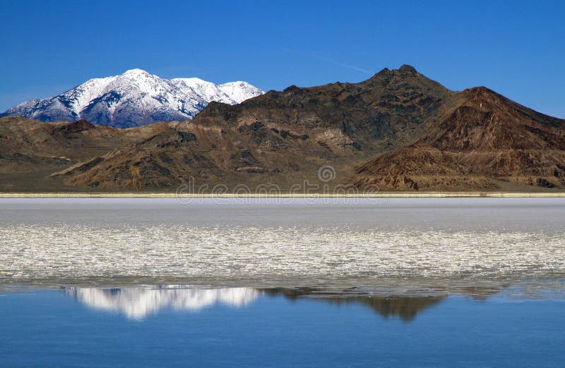 Mountain Reflected on Bonneville Salt Flats in Winter