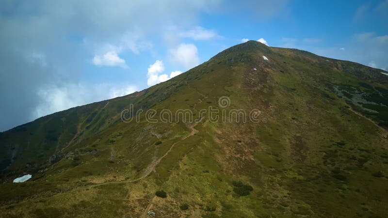Mountain ridge with rocky outcrops. Panoramic view from the top of the ridge on background of valley. Carpathian royalty free stock photos Mountain ridge with rocky outcrops. Panoramic view from the top of the ridge on background of valley. Carpathian royalty free stock photos