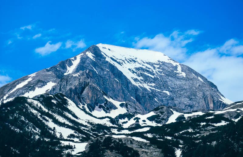 Mountain snow peak, beautiful natural winter backdrop. Ice top o