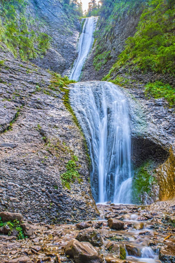 Mountain stream and waterfall on rocks