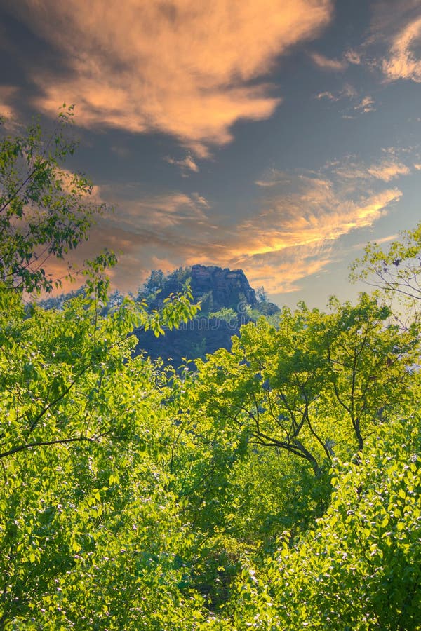 Mountain top in the distance with cool clouds