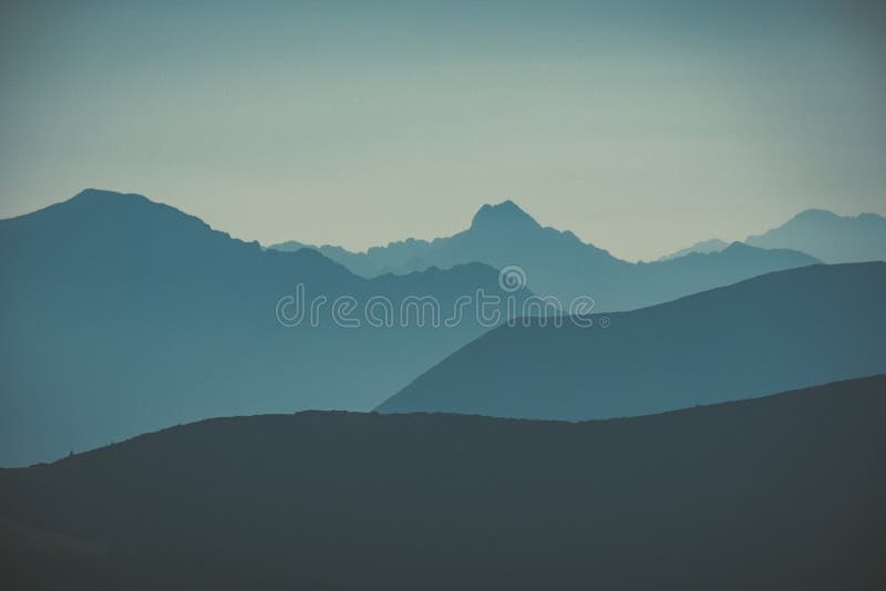 Mountain top panorama in autumn covered in mist or clouds - vin