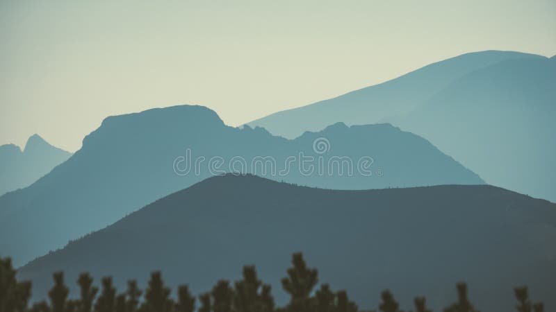 Mountain top panorama in autumn covered in mist or clouds - vin