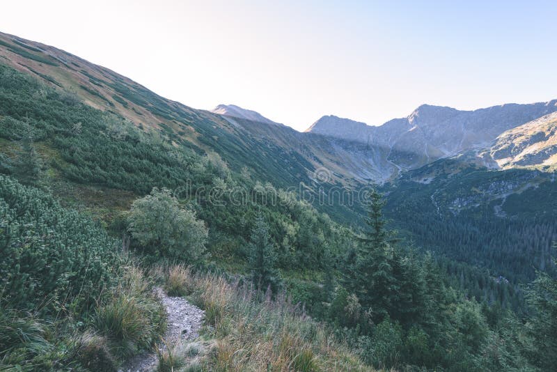 Mountain tops in autumn covered in mist or clouds - vintage ret