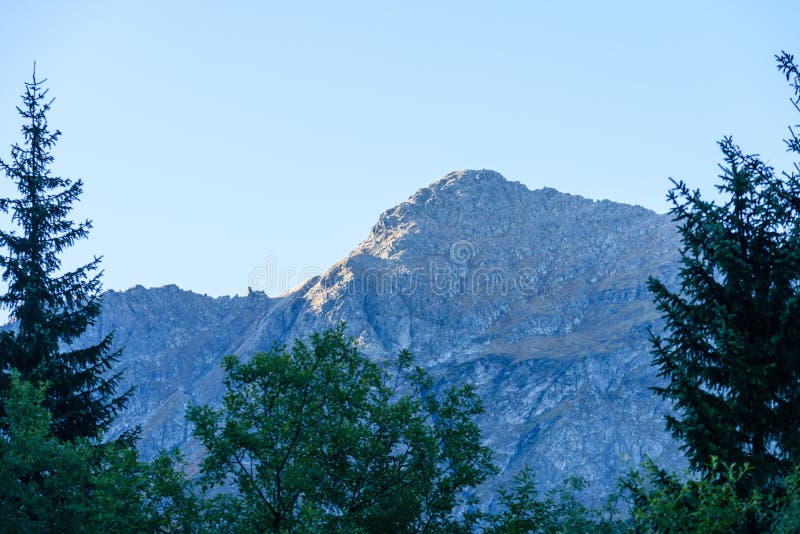 Mountain tops in autumn covered in mist or clouds