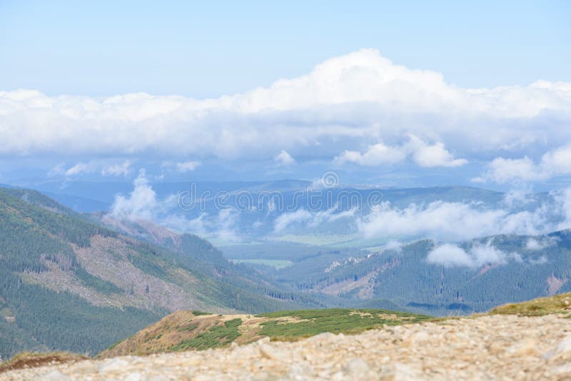 Mountain tops in autumn covered in mist or clouds