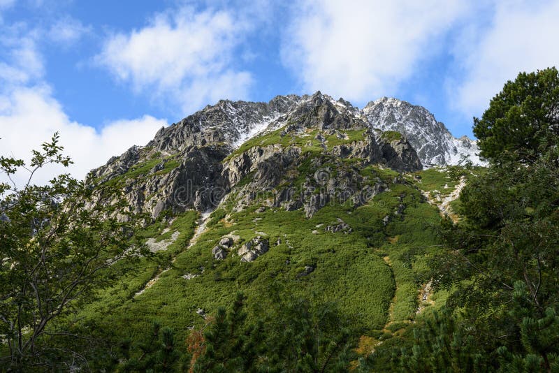 Mountain tops in autumn covered in mist or clouds