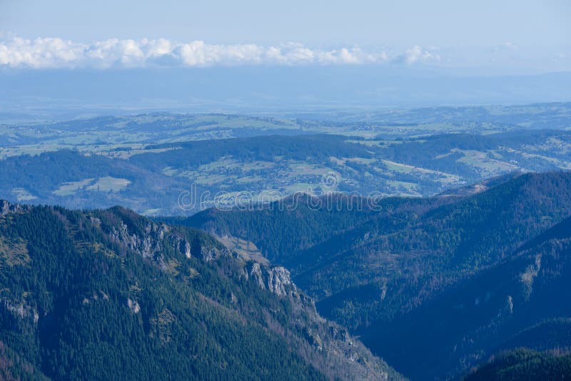 Mountain tops in autumn covered in mist or clouds