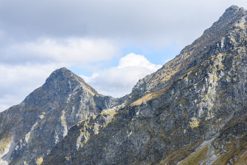 Mountain tops in autumn covered in mist or clouds