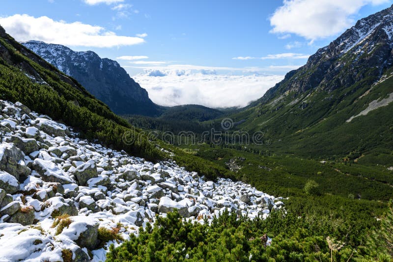 Mountain tops in autumn covered in mist or clouds