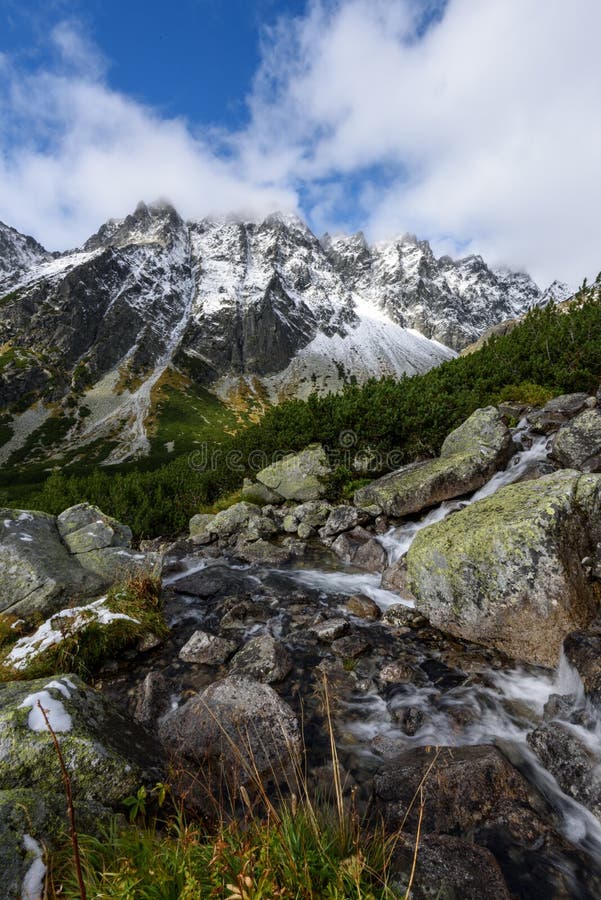 Mountain tops in autumn covered in mist or clouds