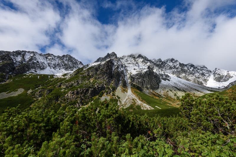 Mountain tops in autumn covered in mist or clouds