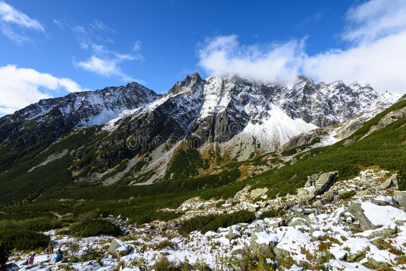 Mountain tops in autumn covered in mist or clouds