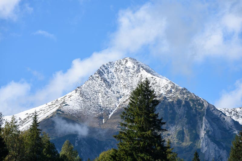 Mountain tops in autumn covered in mist or clouds