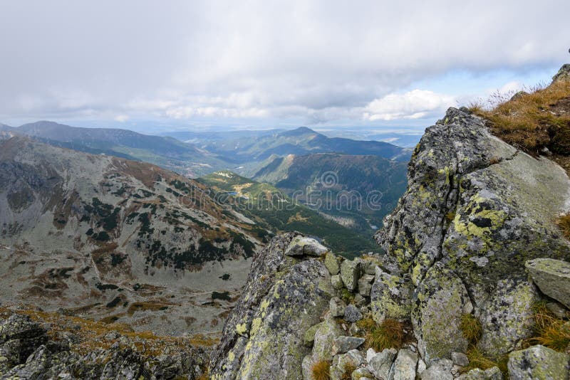 Mountain tops in autumn covered in mist or clouds