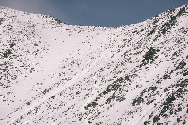 Mountain tops in winter covered in snow - vintage film look