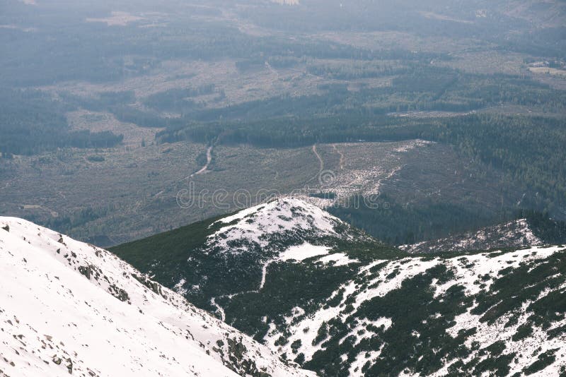 Mountain tops in winter covered in snow - vintage film look