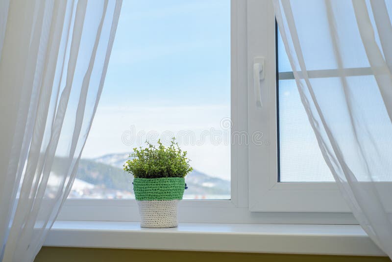 Mountain View from the Window with Curtains. Travel with Comfort Stock