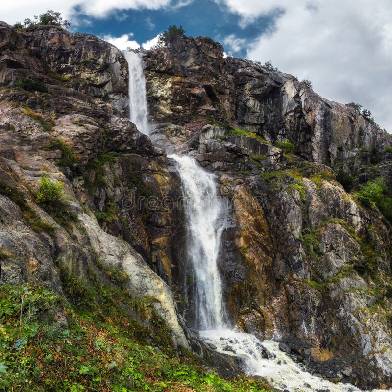 Mountain waterfall from Ushba glasier river Georgia Svaneti