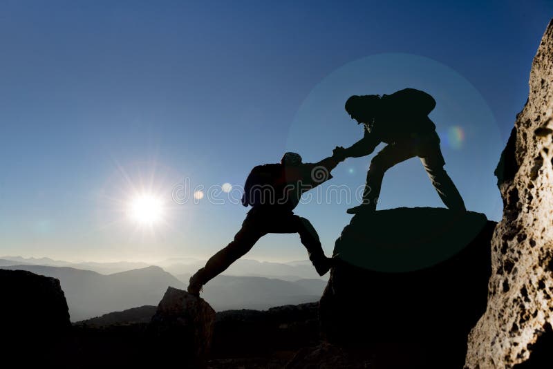 Mountaineer helping another one royalty free stock photos Mountaineer helping another one royalty free stock photos