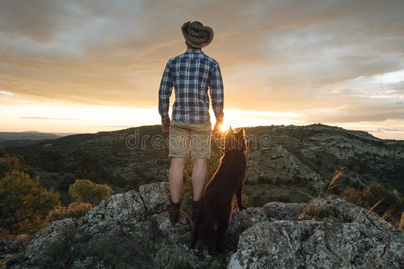 Mountaineer with His Dog in the Mountains Stock Image Image of cliff