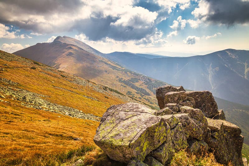 Mountainous landscape with hills and valleys in autumn season