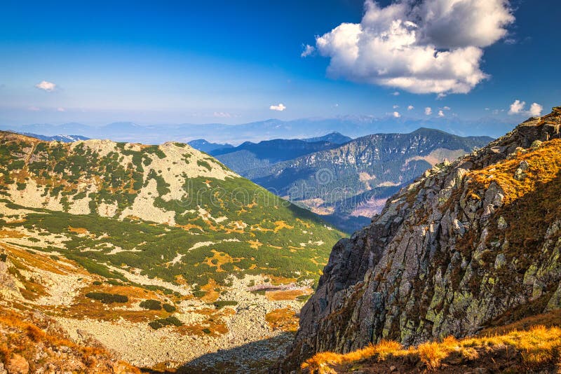 Mountainous landscape with hills and valleys in autumn season