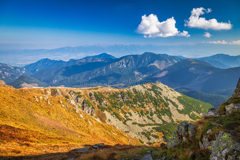 Mountainous landscape with hills and valleys in autumn season