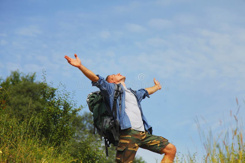 Mountains are calling. Male traveler with backpack trekking in mountains. Mountain is the best place to find yourself royalty free stock image