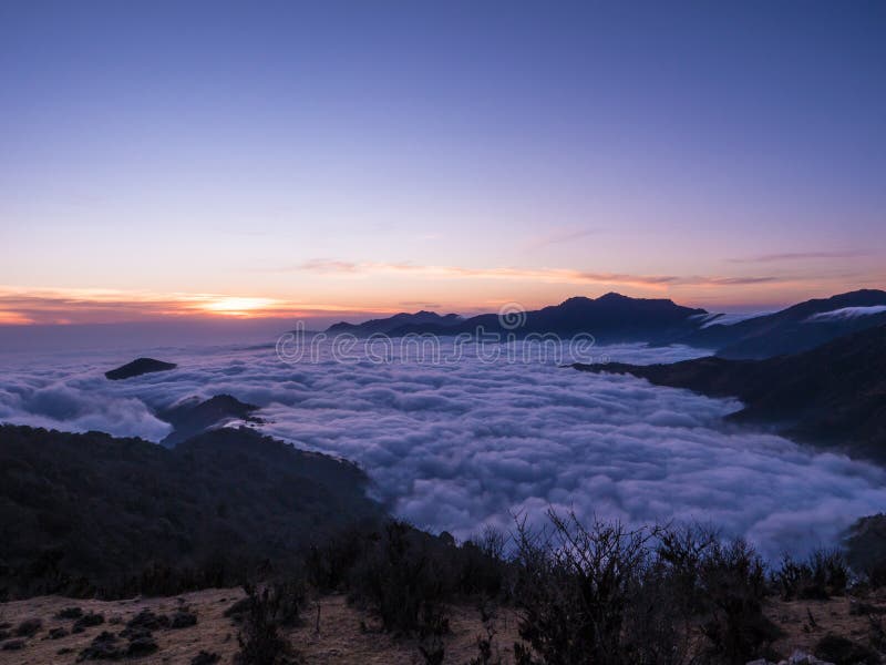Among the clouds on top of mountains sunsetime stock photo Among the clouds on top of mountains sunsetime stock photo