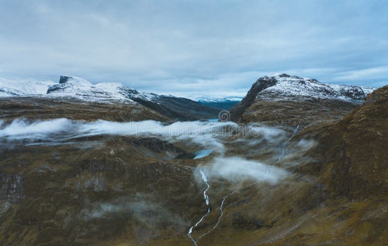 Mountains in Norway aerial view landscape travel in wilderness. Scandinavian nature drone scenery above clouds stock photos Mountains in Norway aerial view landscape travel in wilderness. Scandinavian nature drone scenery above clouds stock photos