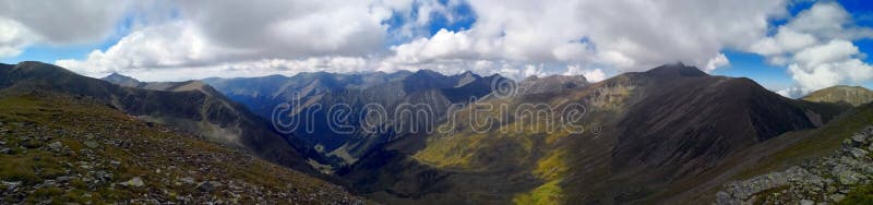 Mountains under blue sky scattered with white fluffy clouds. Amazing landscape panorama in the mountains. Rea trail stock images, royalty-free photos and pictures