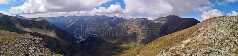 Mountains under blue sky scattered with white fluffy clouds. Amazing landscape panorama in the mountains. Rea trail stock images, royalty-free photos and pictures