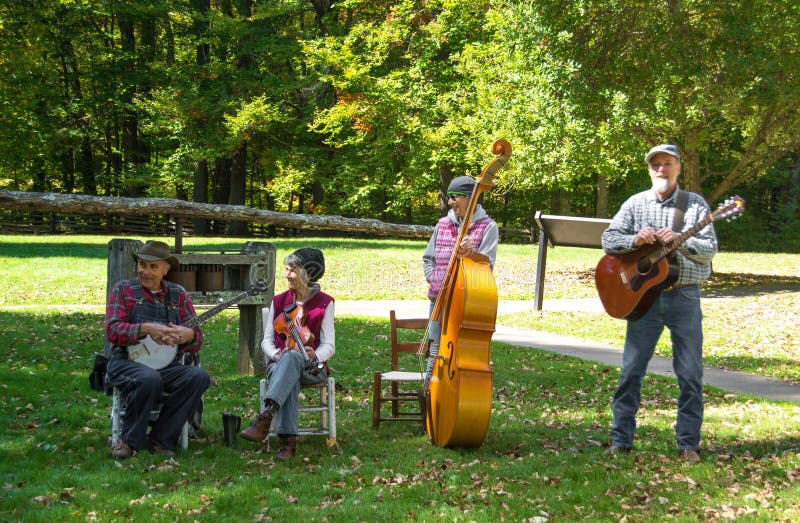Floyd County, VA – October 6, 2014: Musician playing mountain music at Mabry Mill on the Blue Ridge Parkway on October 6, 2014, Floyd County, Virginia, USA. Floyd County, VA – October 6, 2014: Musician playing mountain music at Mabry Mill on the Blue Ridge Parkway on October 6, 2014, Floyd County, Virginia, USA.